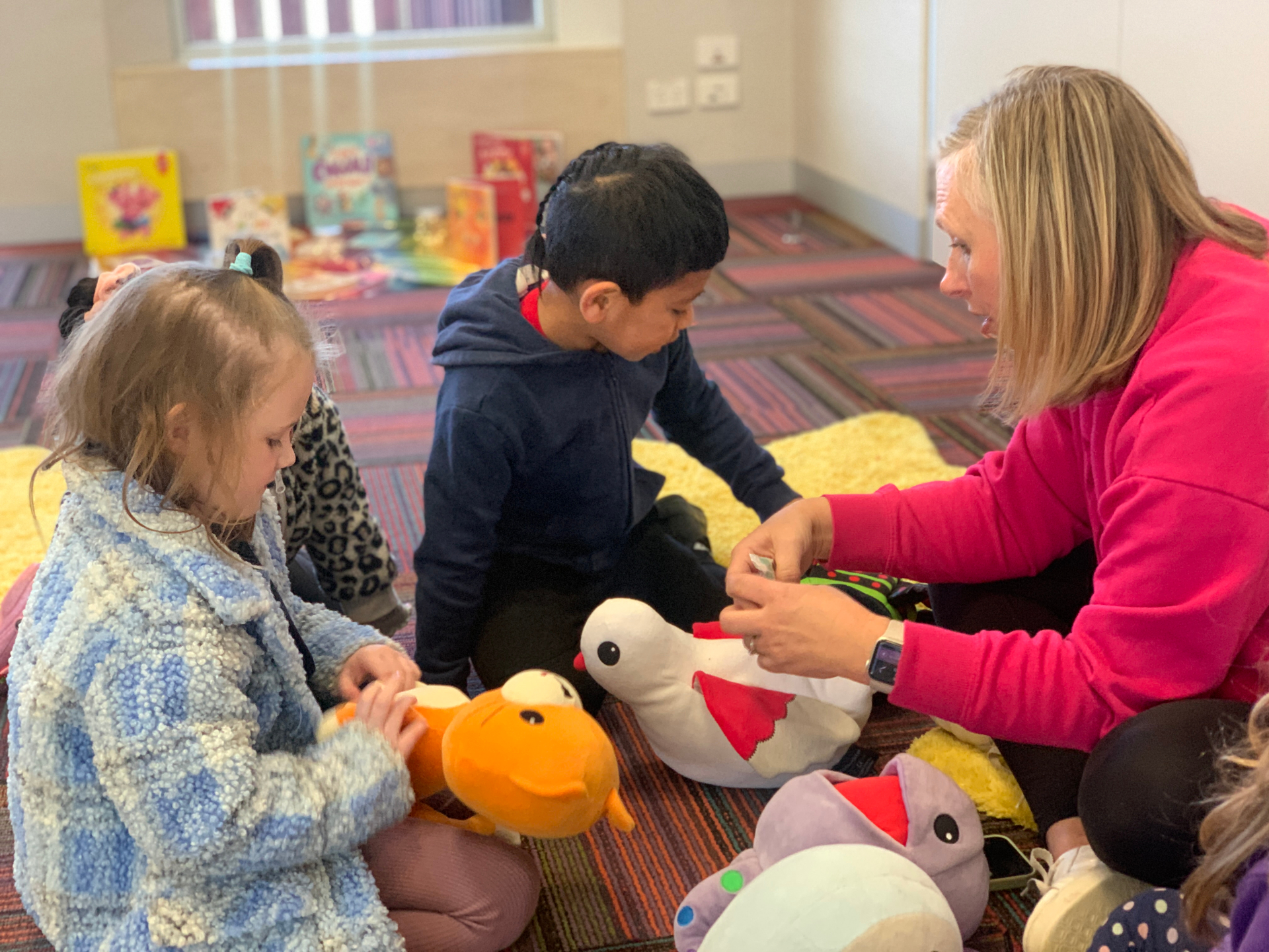 An Eluma early childhood teacher and children working together during a small-group session